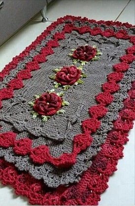 Crochet gray and red kitchen rug Photo by Pinterest