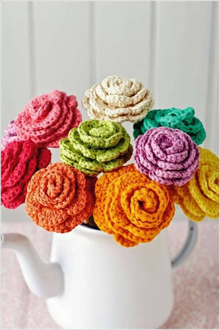 various colorful crochet flowers in watering can-min
