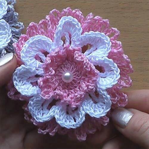 Pink crochet flowers on white