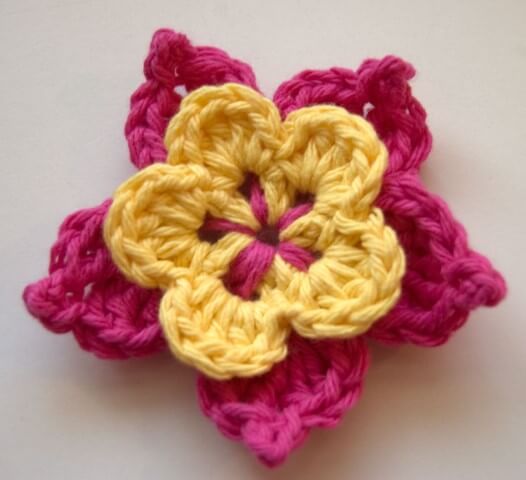 Pink and yellow crochet flower