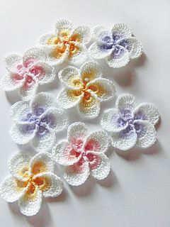 White crochet flower with colorful centers