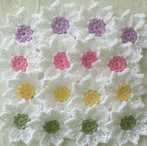 White crochet flower with colorful center