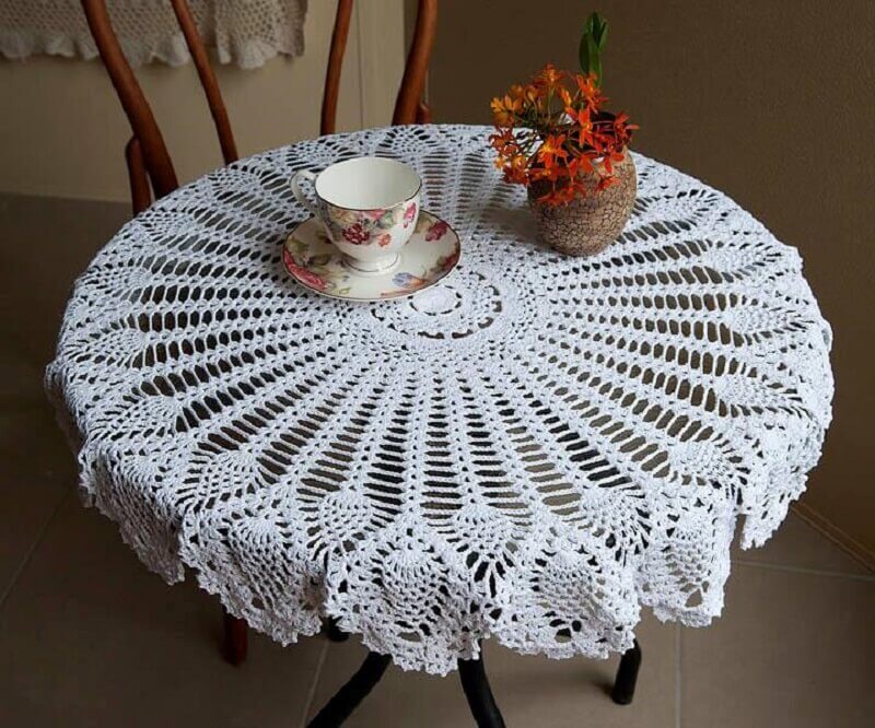 white crochet round tablecloth