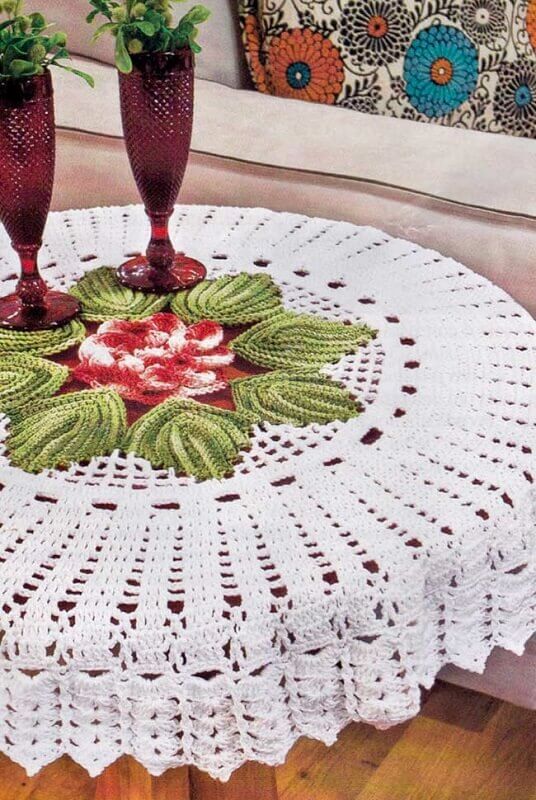 round crochet tablecloth with colorful detail in the center