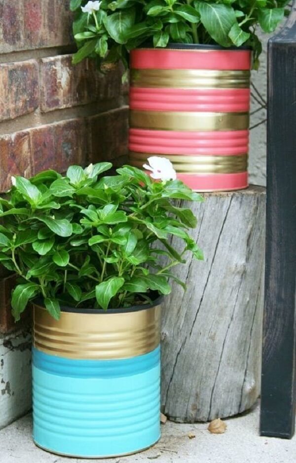 Decorated cans can serve as a support for plants