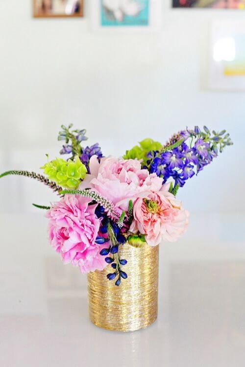 Decorated cans for flower arrangement