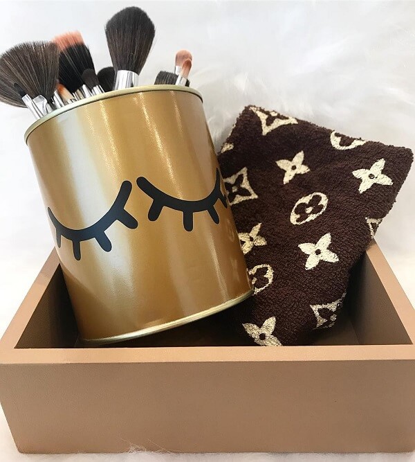 Use the decorated cans to organize your makeup brushes