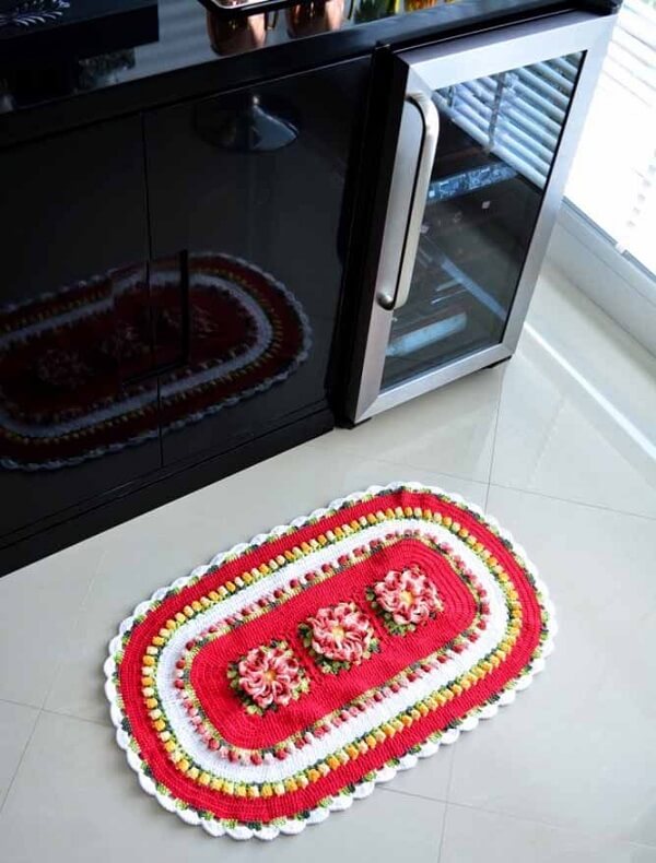 Place the oval crochet rug next to the sink to prevent the floor from getting wet