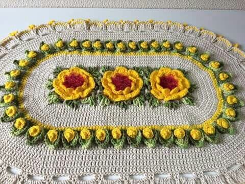 Oval crochet rug with yellow flowers