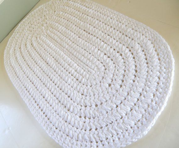 White oval crochet rug