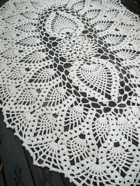 White oval crochet rug with different print