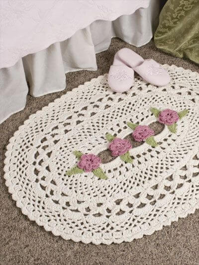Oval crochet rug with flowers in the center