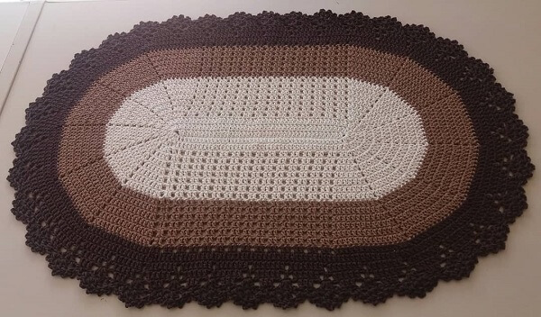 Oval crochet rug with black border