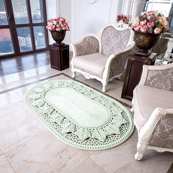Oval crochet rug decorates the living room