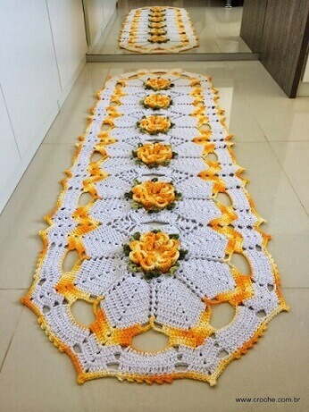Oval crochet rug with yellow flowers