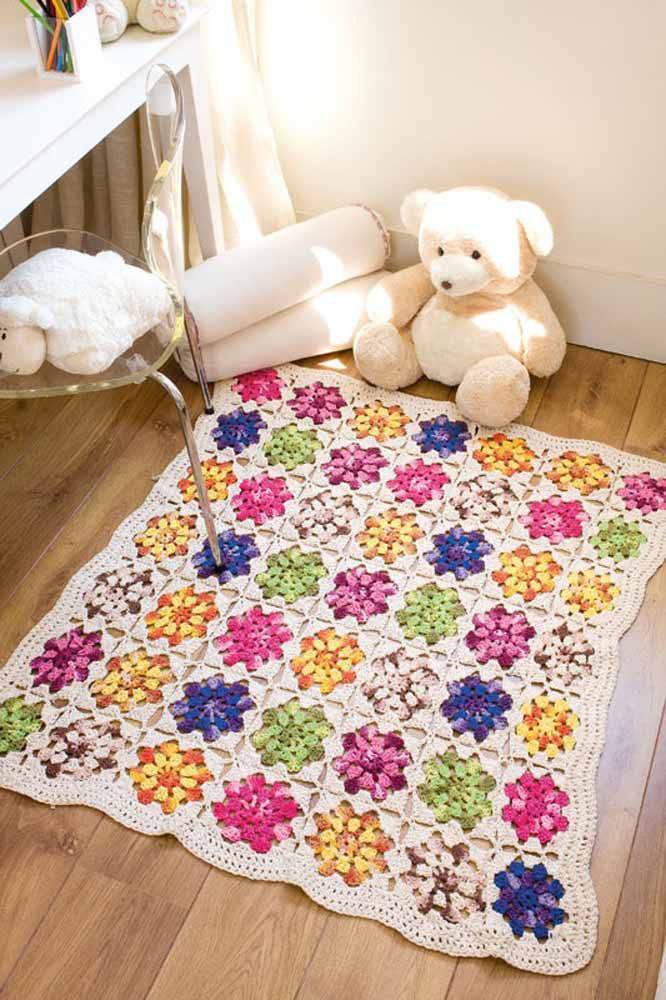 Square crochet rug with colorful flower