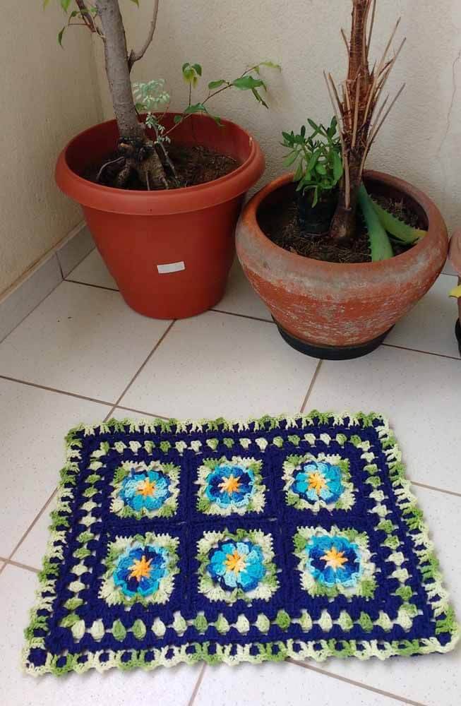 square crochet rug with flower