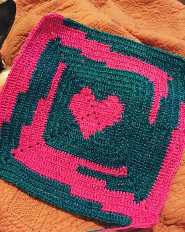 Pink and blue square crochet rug