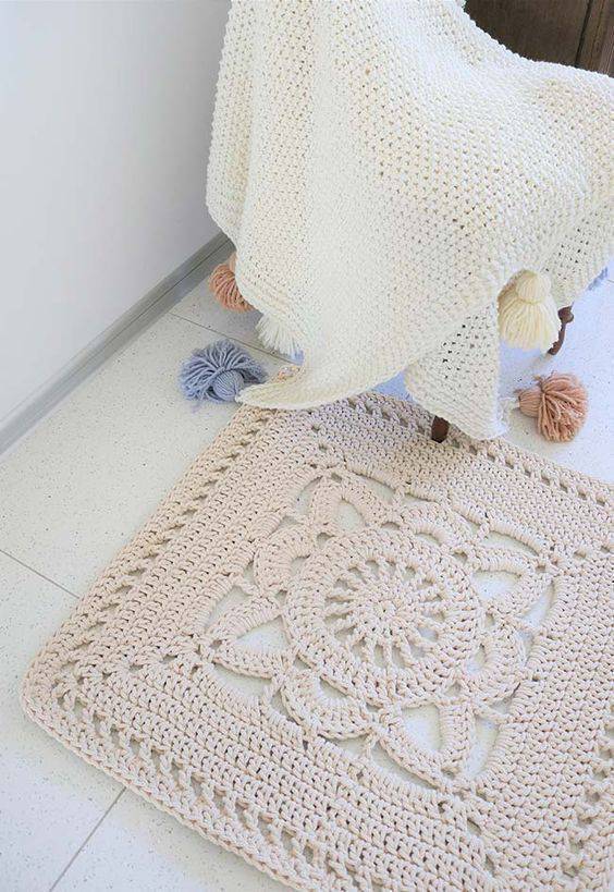 Square crochet rug with flower
