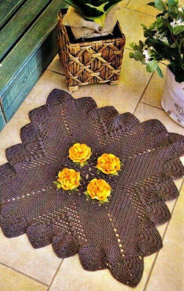 Square crochet rug with yellow flower