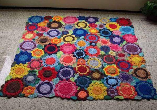 Colorful square crochet rug with flower