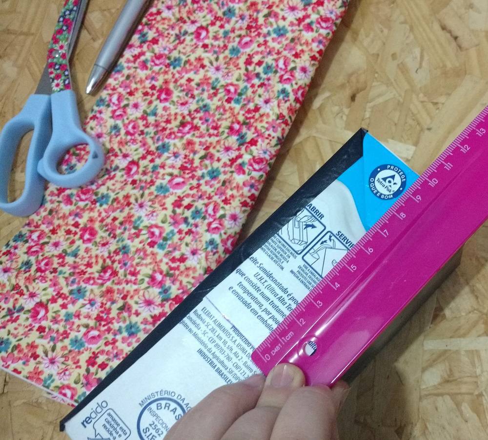 Measuring the box is a crucial part for an exact cut in this milk carton craft