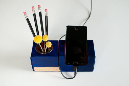 You can create a cell phone holder to organize your home office desk