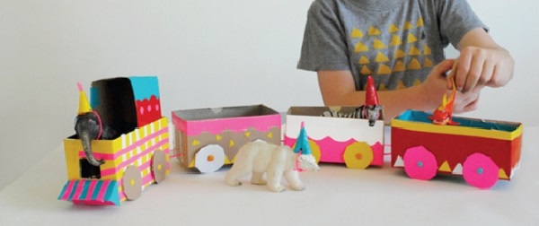 Handicraft with milk carton forms a charming little train