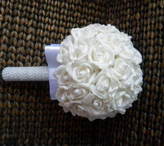 A bouquet of white EVA with pearls like this is super charming