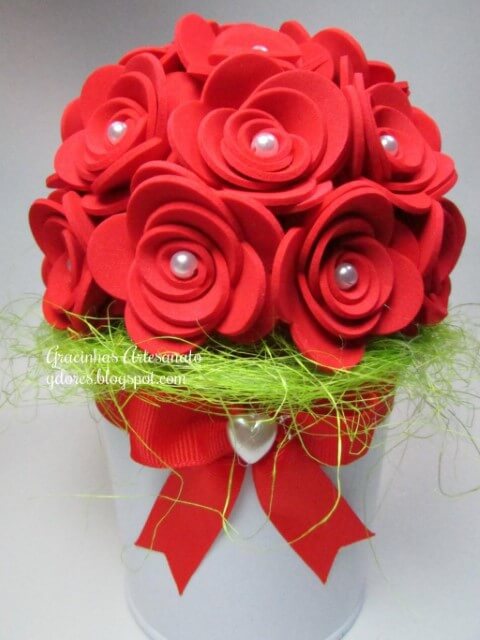 Red EVA flowers with pearl center in arrangement