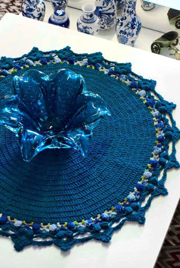 Round and blue crochet centerpiece with vase of the same color