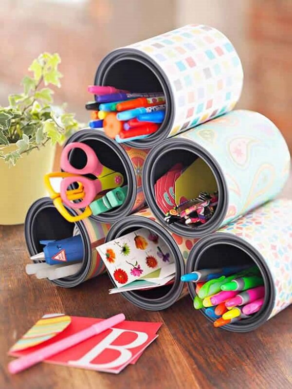 Decorated cans help organize the room