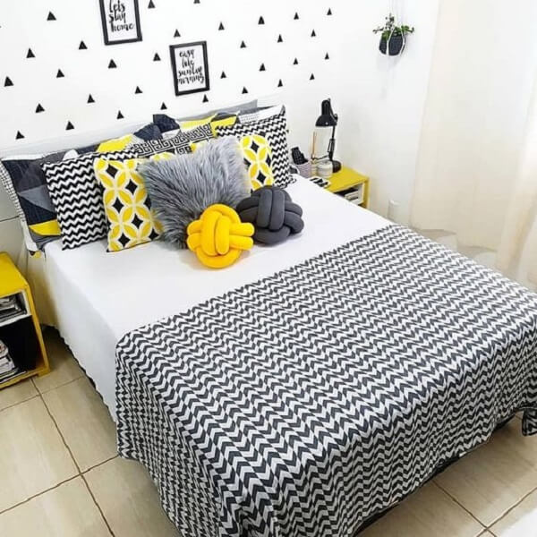 Knot cushion in shades of gray and yellow blend with the decor of the room