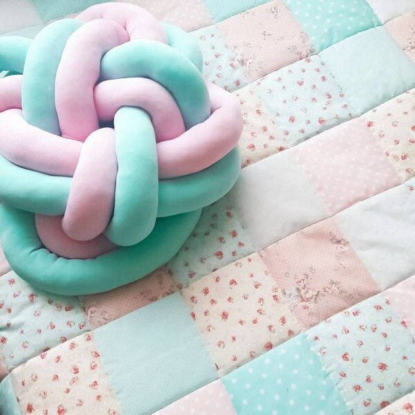 Mixed knot cushion in shades of pink and green