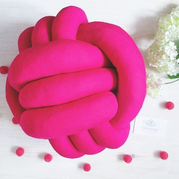 Pink knot cushion brings life to the environment