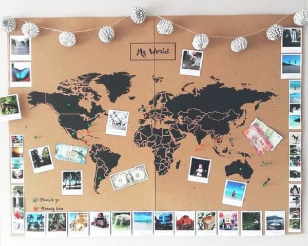 Corkboard with the design of the World Map and numerous photos
