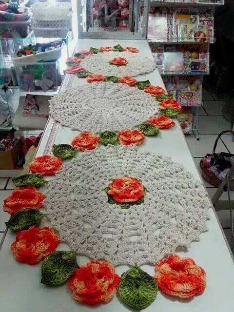 Crochet table runner with bard of orange flowers