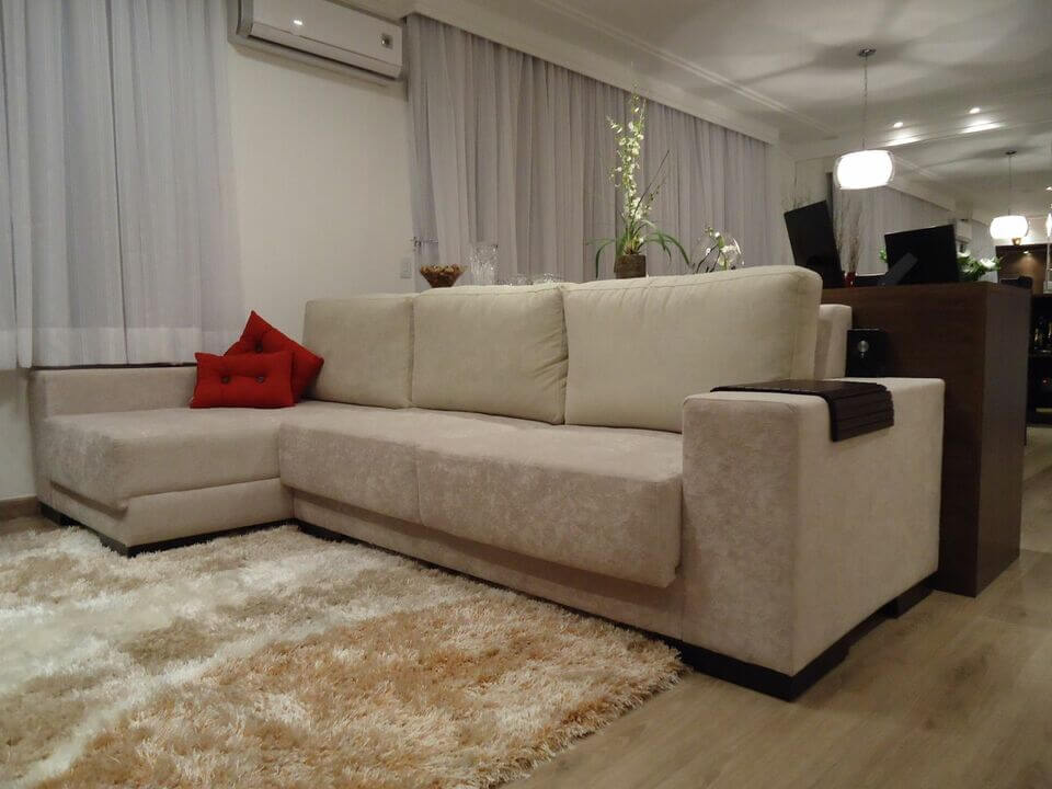 medusa rug - TV room with plush rug and L-shaped sofa