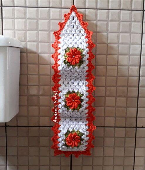 Orange crochet toilet paper holder