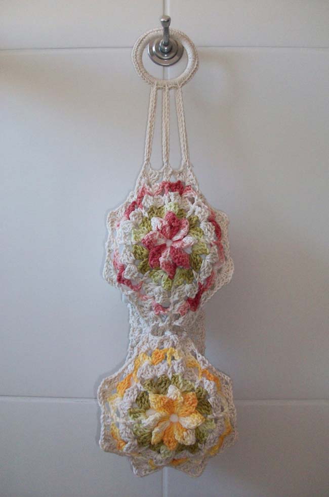 Decorated crochet toilet paper holder