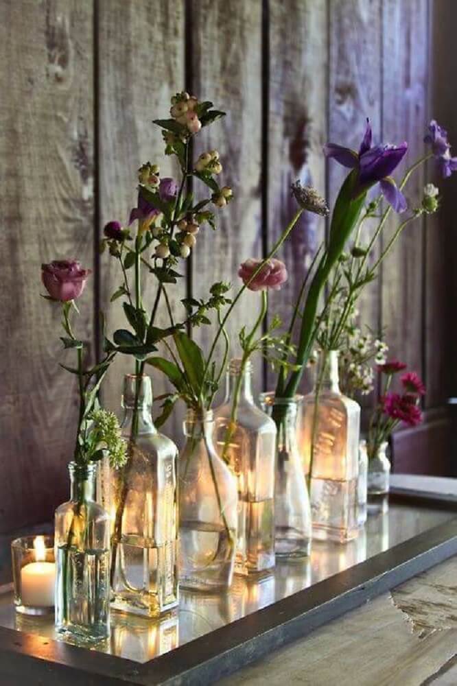 decoration made with glass bottles like flower pots