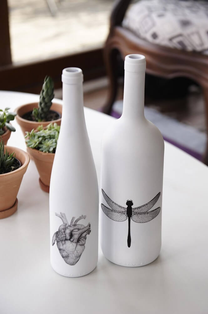 Bottles decorated with white matte paint and stickers