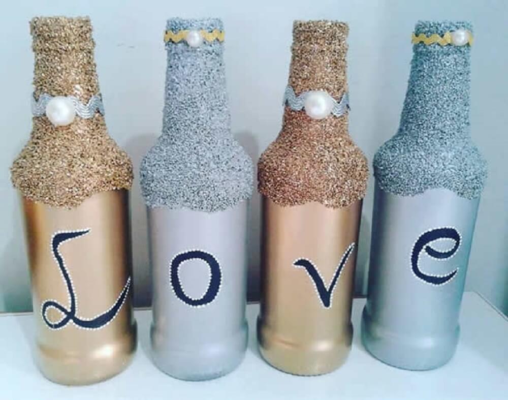 Bottles decorated with glitter and written LOVE