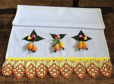 Crochet hook for dishcloth in shades of yellow and orange with detail of fruits and flowers Photo by Elaine Crochet