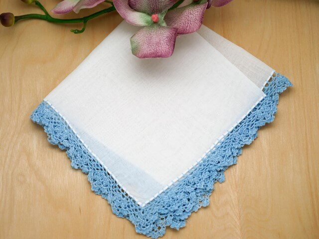 Crochet hook for blue dishcloth throughout the piece Photo by Bumblebee Linens