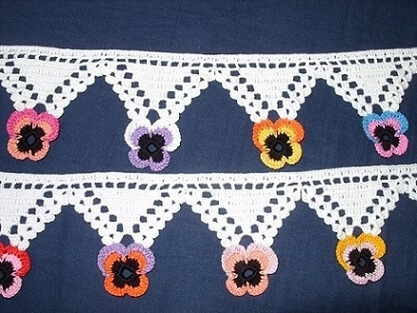 White crochet nozzle with colorful flower tip