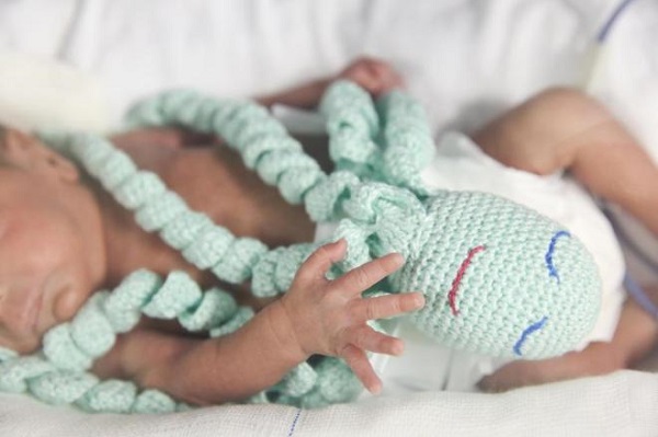 Crocheted octopus imparts a feeling of protection to newborns