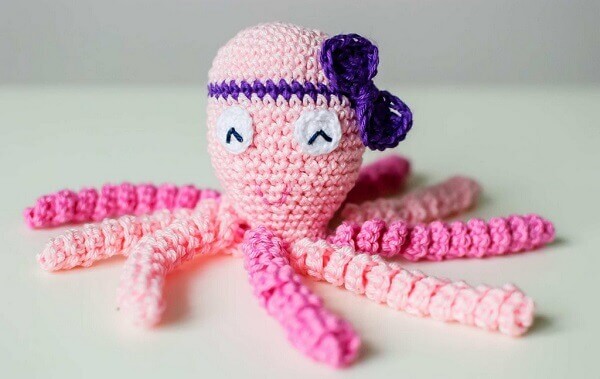 Crochet octopus with purple bow