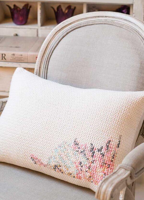 Cushion with cross stitch detail