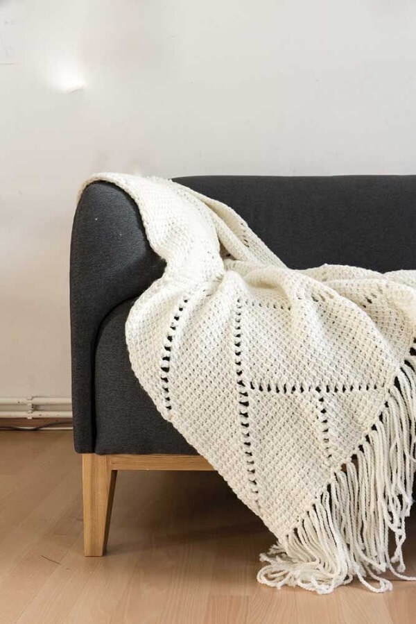 White sofa blanket made in Tunisian crochet